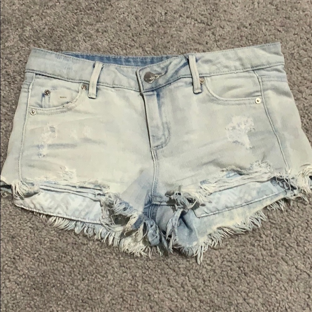 Acid wash cutoff ripped jean shorts